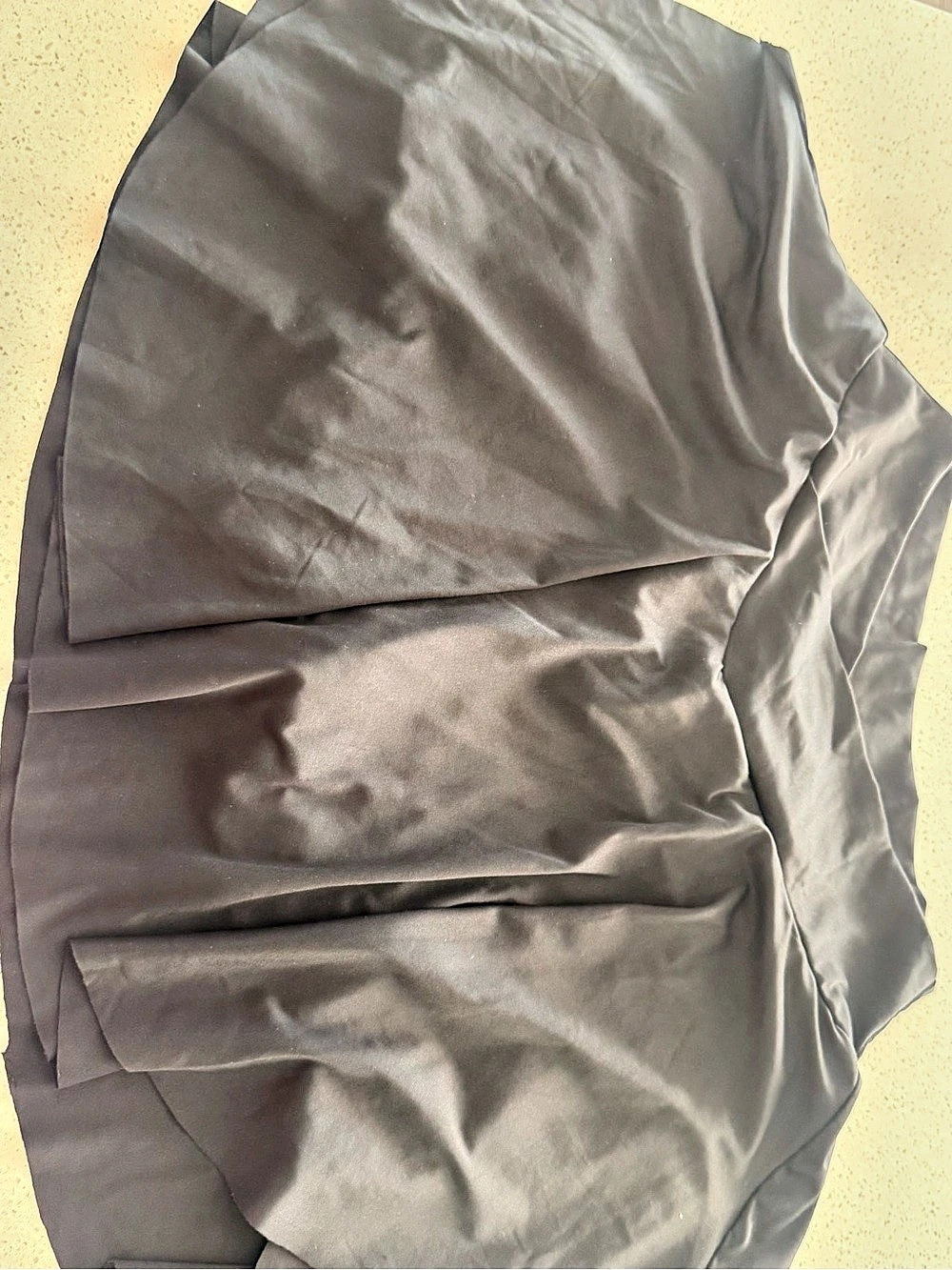 Satin mini Tennis Skirt in Black Like New. Built in shorts. Butter soft, not wor